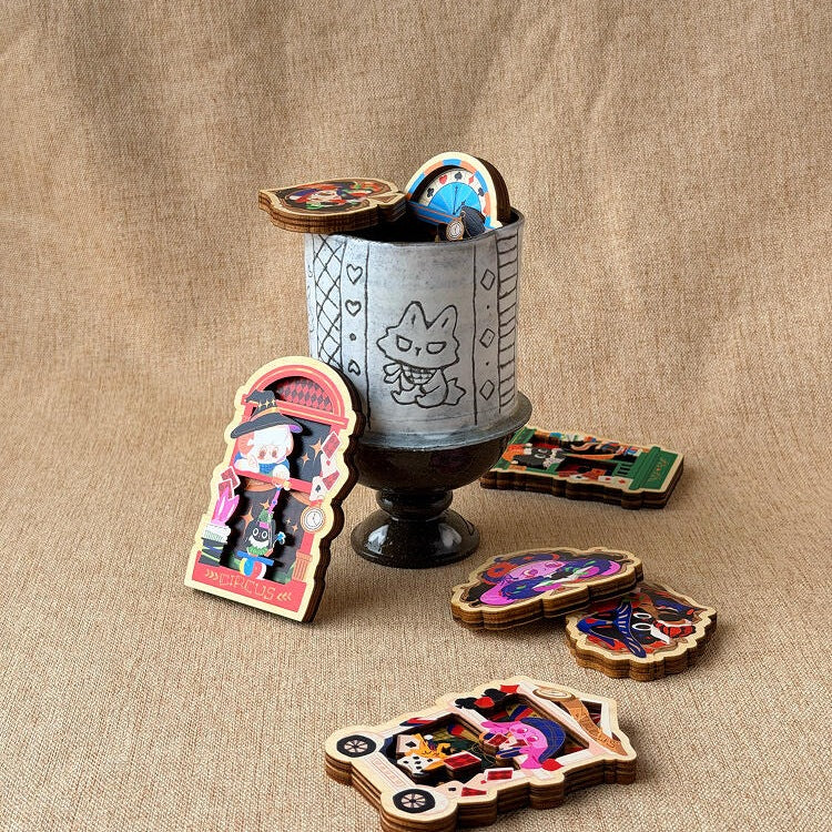 Magnets from the series arranged around a pewter cup
