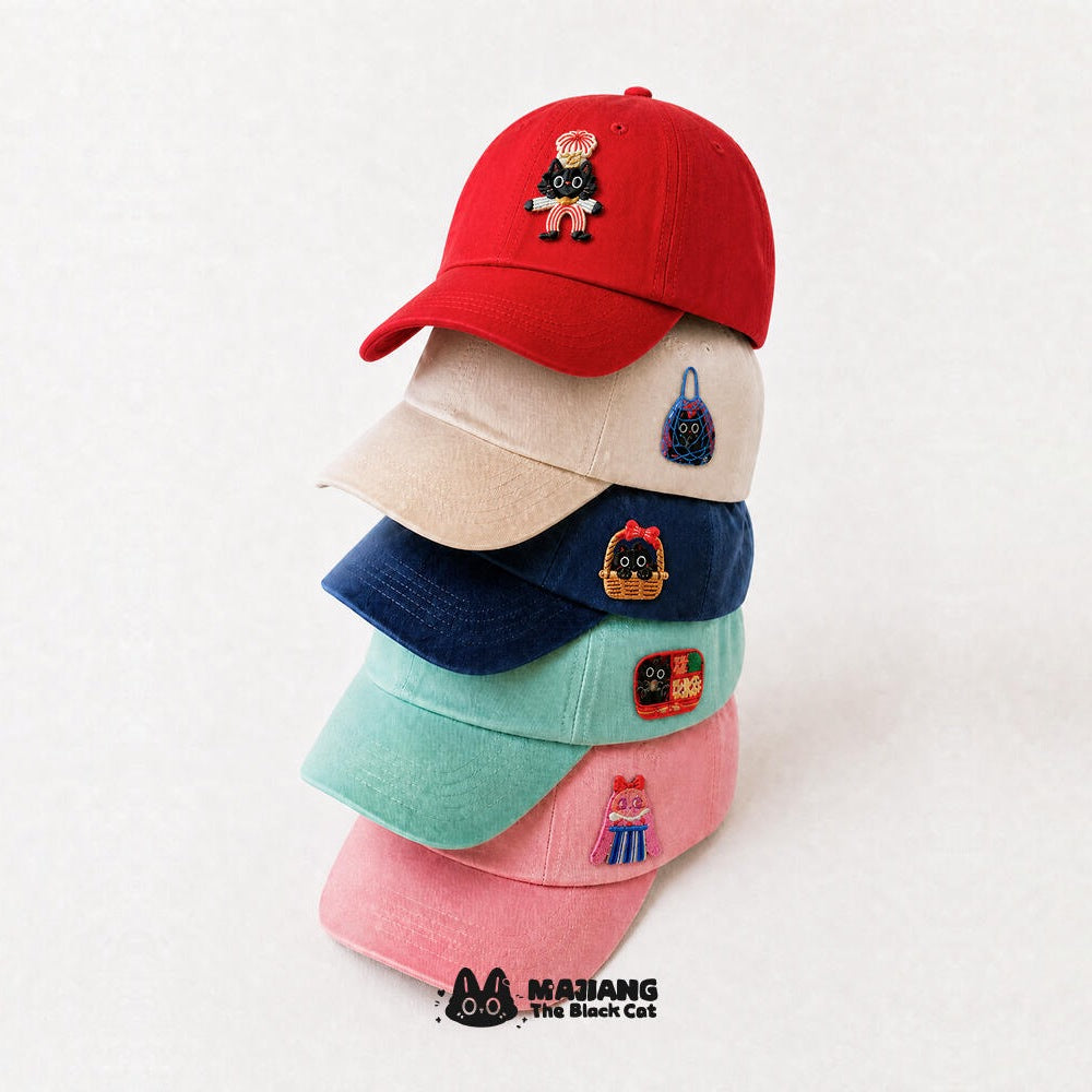 Majiang the Black Cat patches on a stack of baseball caps
